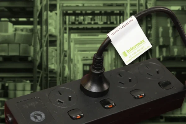 Power strip with a Test & Tag certification label, ensuring compliance with AS/NZS 3760 standards for workplace safety.