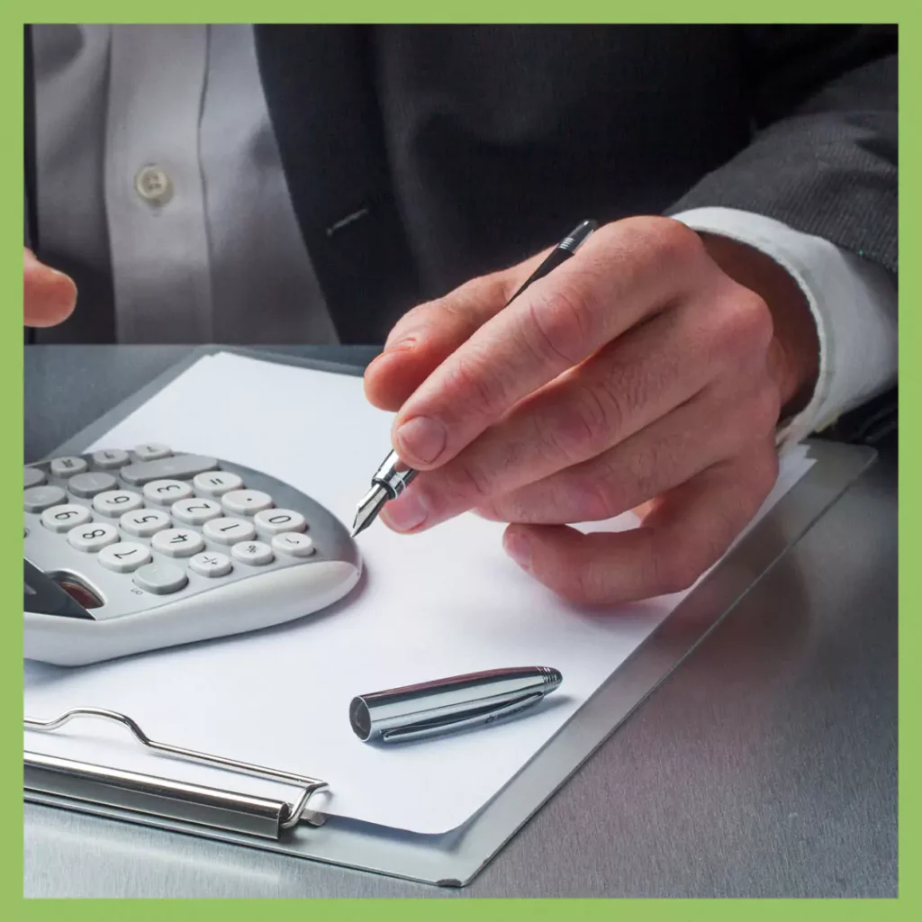 Business professional reviewing a Test & Tag service quote with a calculator and clipboard for transparent pricing.