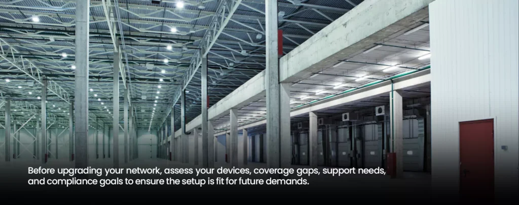 Wide view of an empty warehouse facility highlighting structural layout for wireless network planning and infrastructure upgrades